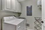Laundry room with full size washer and dryer